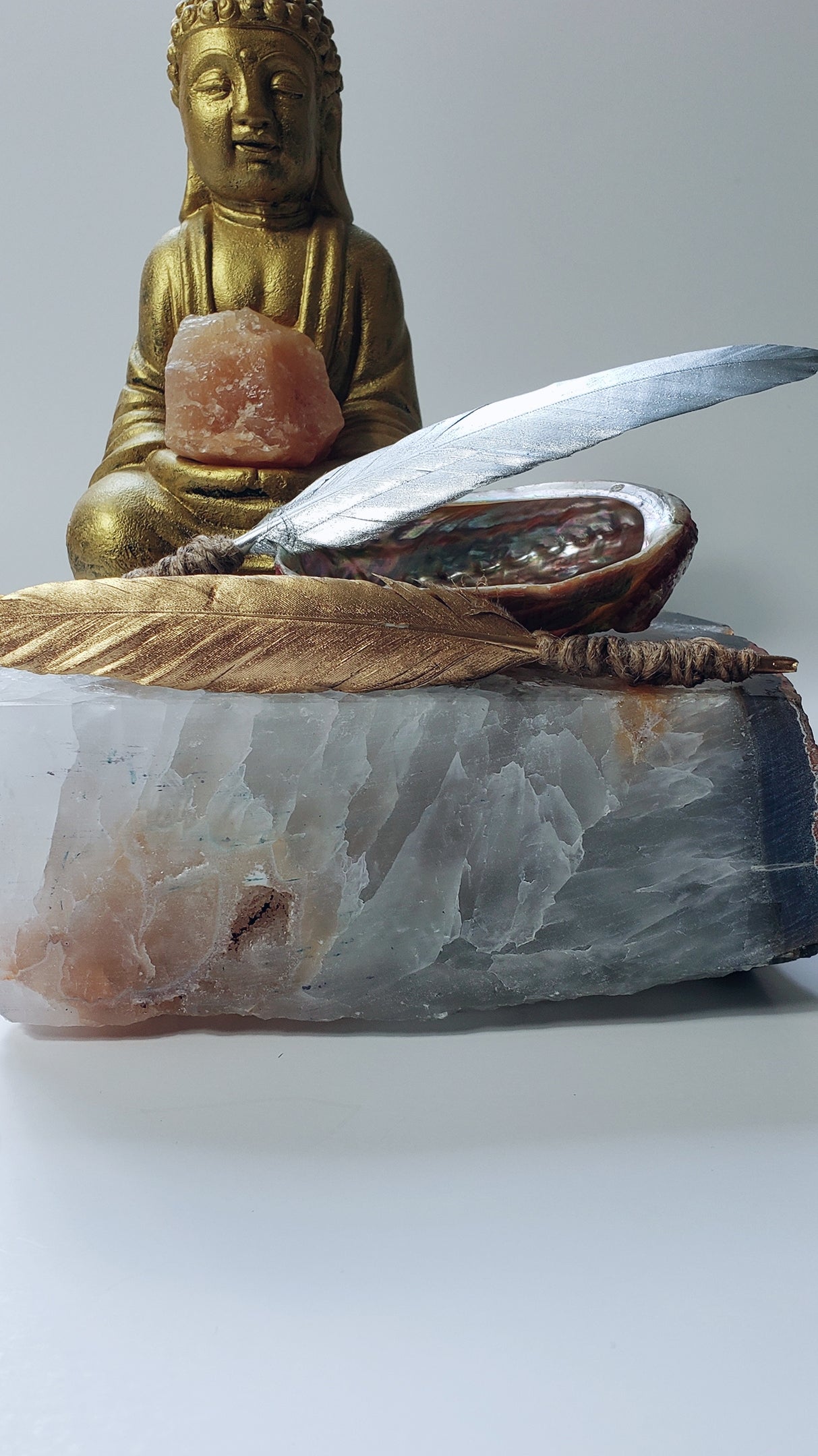 Gold Sun Energy Smudging Feather and Silver Moon Energy Smudging Feathers.